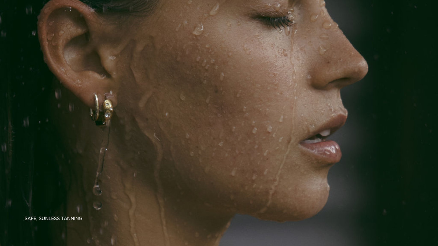 a glowing tan face with summerbrons. glow drops